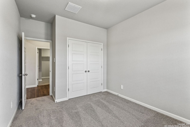 11559 Cottage Pt, San Antonio, TX 78254 - unfurnished bedroom with a closet and carpet