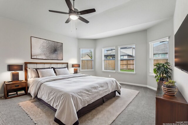 11559 Cottage Pt, San Antonio, TX 78254 - bedroom featuring multiple windows, light colored carpet, and ceiling fan