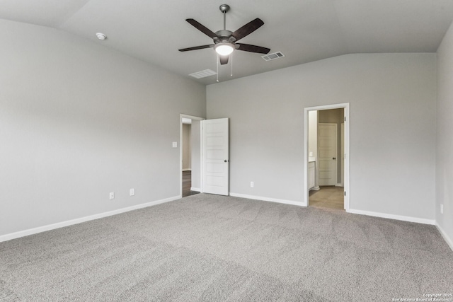 11559 Cottage Pt, San Antonio, TX 78254 - unfurnished bedroom with light colored carpet, lofted ceiling, and ensuite bathroom