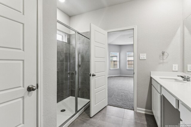 11559 Cottage Pt, San Antonio, TX 78254 - bathroom featuring tile patterned flooring, vanity, and walk in shower