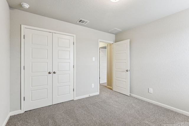 11559 Cottage Pt, San Antonio, TX 78254 - unfurnished bedroom featuring a closet and light carpet