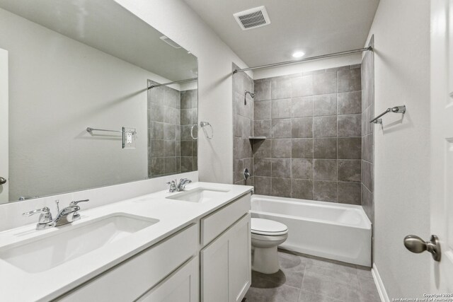 11559 Cottage Pt, San Antonio, TX 78254 - full bathroom with vanity, tiled shower / bath combo, tile patterned floors, and toilet