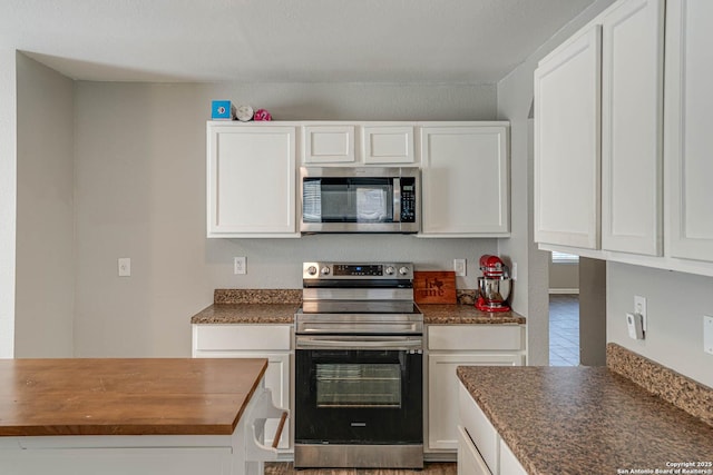 kitchen with white cabinetry and stainless steel appliances