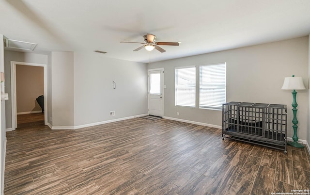 spare room featuring ceiling fan and dark hardwood / wood-style flooring