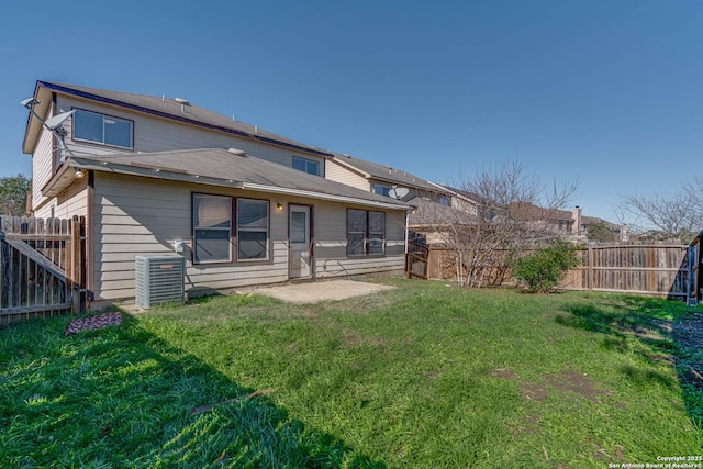 back of property featuring central air condition unit, a patio area, and a yard