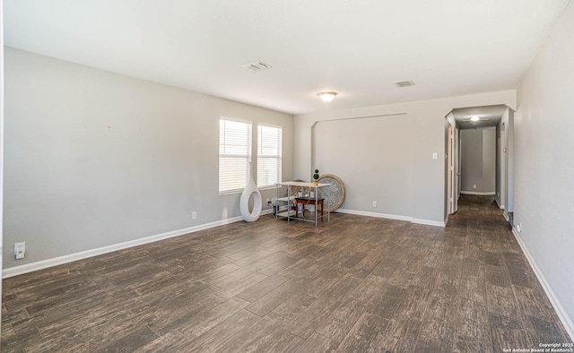 spare room with dark hardwood / wood-style floors