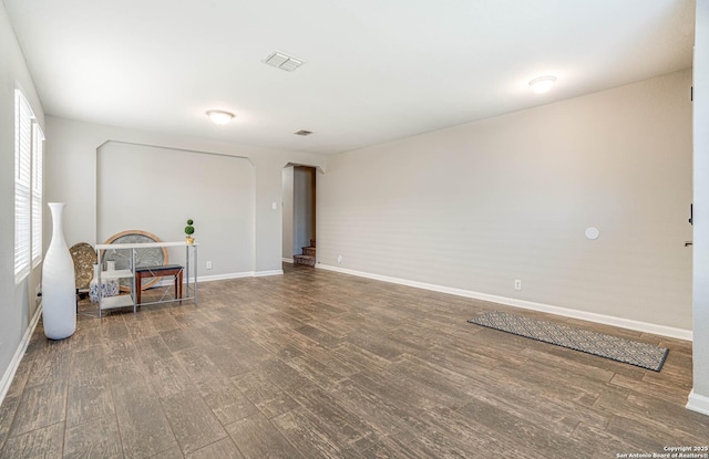 sitting room with dark hardwood / wood-style flooring