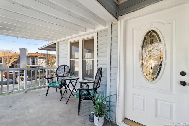 entrance to property featuring covered porch