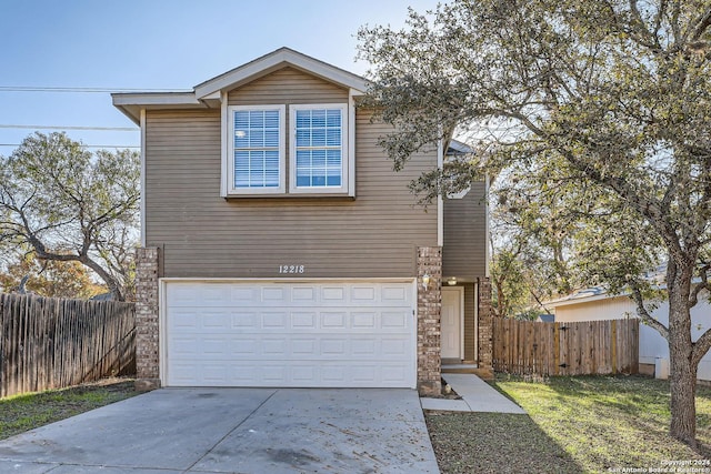 front of property with a garage