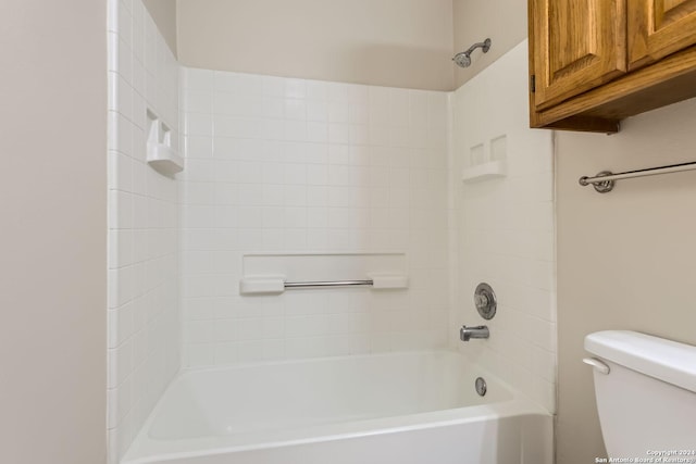 bathroom featuring toilet and tub / shower combination