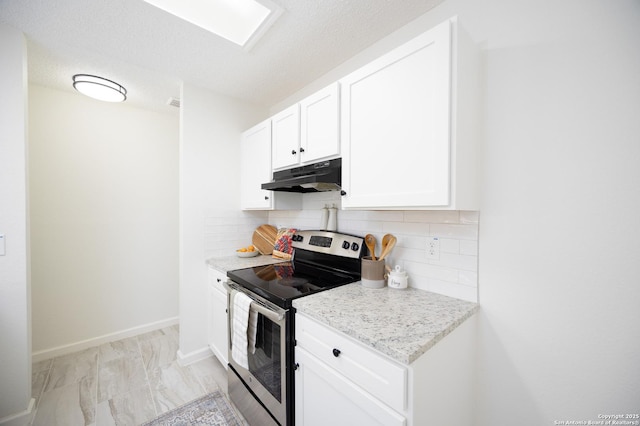 kitchen featuring white cabinetry, tasteful backsplash, light stone counters, a textured ceiling, and stainless steel electric range