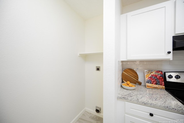 clothes washing area with hookup for an electric dryer