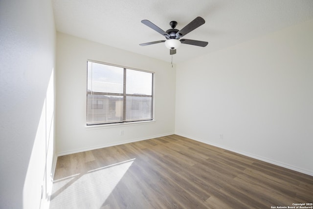 unfurnished room featuring ceiling fan and wood-type flooring