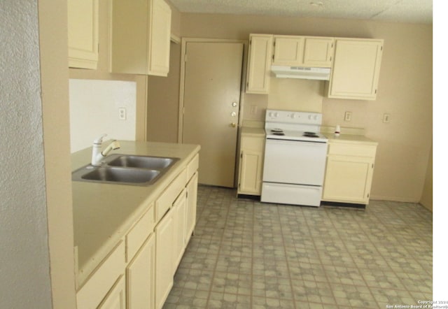 kitchen featuring sink, white cabinets, and white electric stove