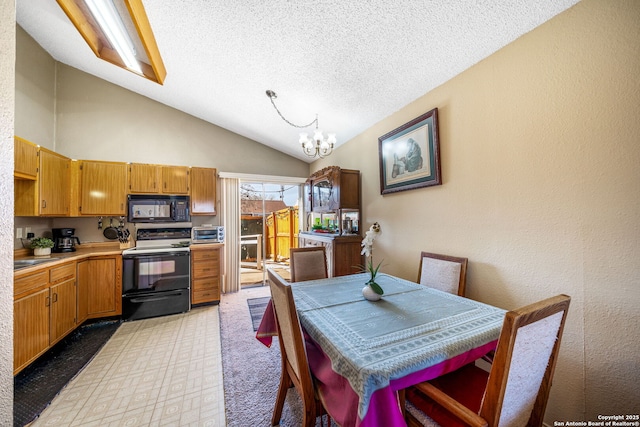 dining room featuring light carpet, an inviting chandelier, a textured ceiling, and lofted ceiling