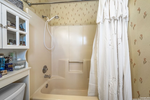 bathroom with toilet and shower / bath combo