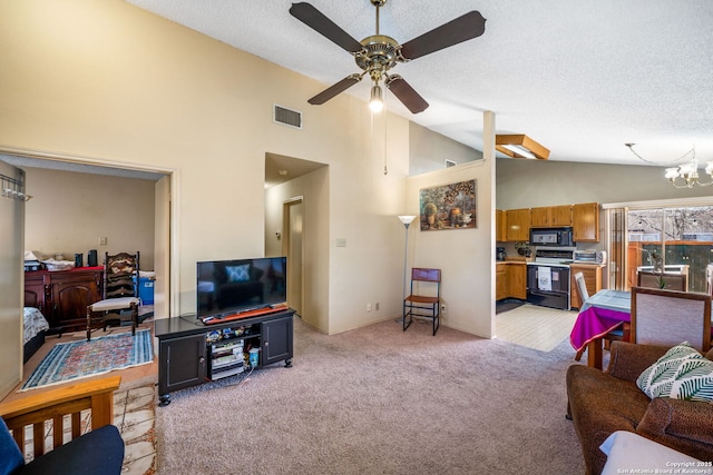 living room featuring a textured ceiling, ceiling fan with notable chandelier, light colored carpet, and high vaulted ceiling