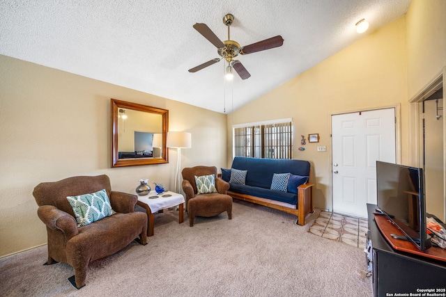 living room with vaulted ceiling, ceiling fan, a textured ceiling, and carpet floors