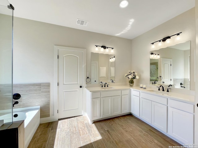 bathroom featuring a bathtub and vanity