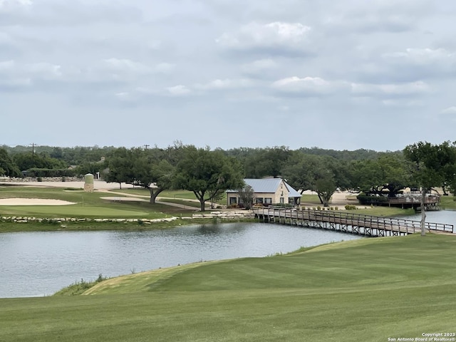 surrounding community with a water view