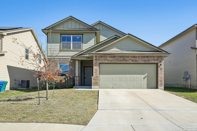 craftsman inspired home with a garage, a front yard, and central AC unit