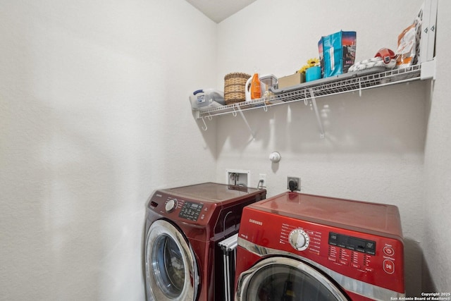 clothes washing area featuring washing machine and dryer