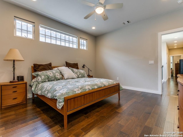 bedroom with dark wood-type flooring and ceiling fan