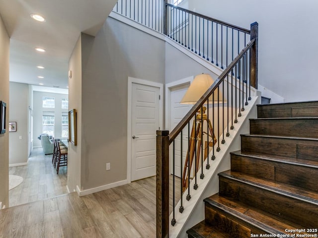 stairway featuring hardwood / wood-style flooring