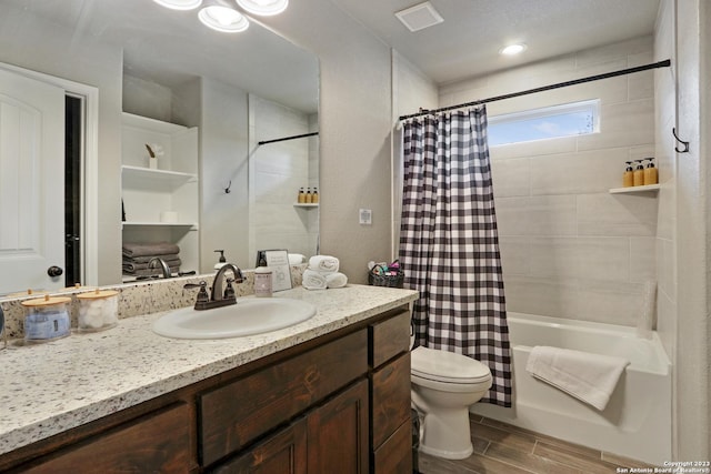 652 Canyon Bnd, Canyon Lake, TX 78133 - full bathroom with toilet, shower / tub combo, and vanity