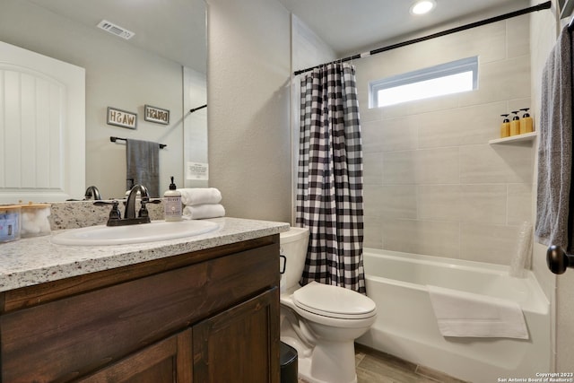 652 Canyon Bnd, Canyon Lake, TX 78133 - full bathroom featuring toilet, vanity, and shower / bathtub combination with curtain