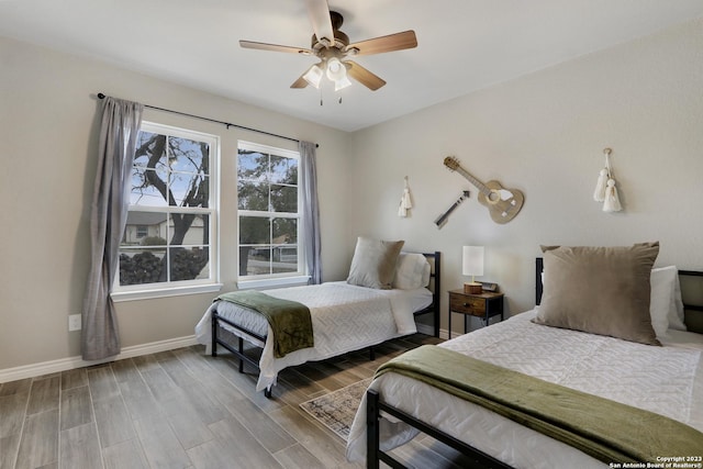 652 Canyon Bnd, Canyon Lake, TX 78133 - bedroom featuring ceiling fan and hardwood / wood-style flooring
