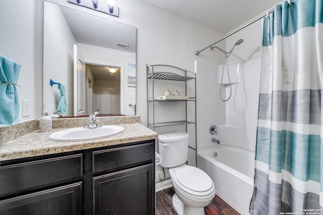 full bathroom with wood-type flooring, toilet, vanity, and shower / tub combo with curtain