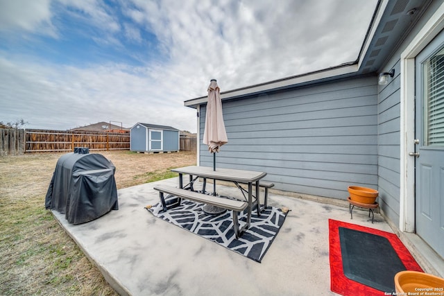 view of patio featuring a shed