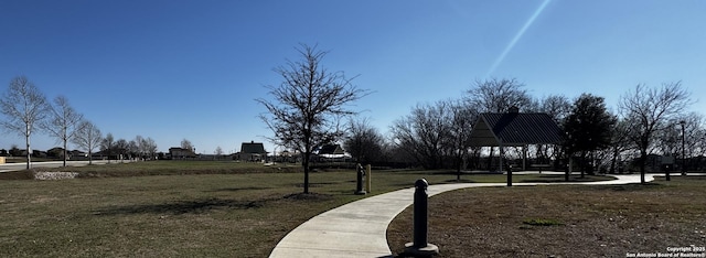 surrounding community featuring a gazebo and a yard