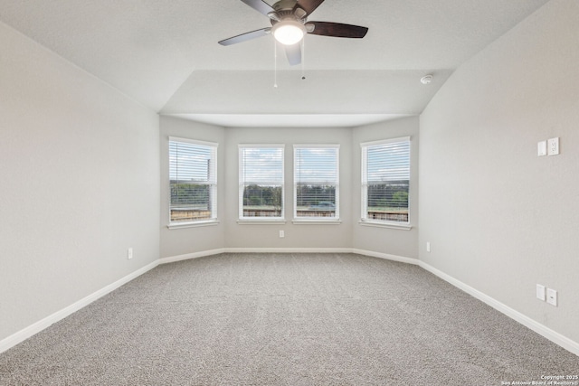 carpeted spare room with lofted ceiling and ceiling fan