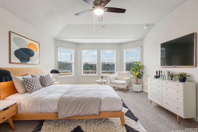 bedroom with carpet floors, ceiling fan, and vaulted ceiling