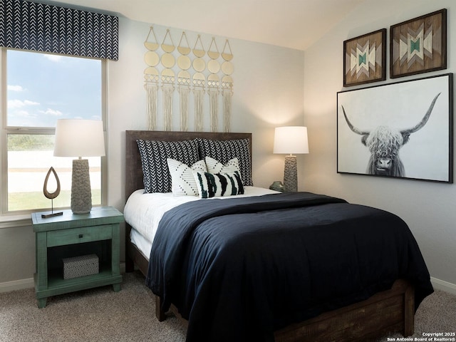 bedroom featuring carpet floors and lofted ceiling