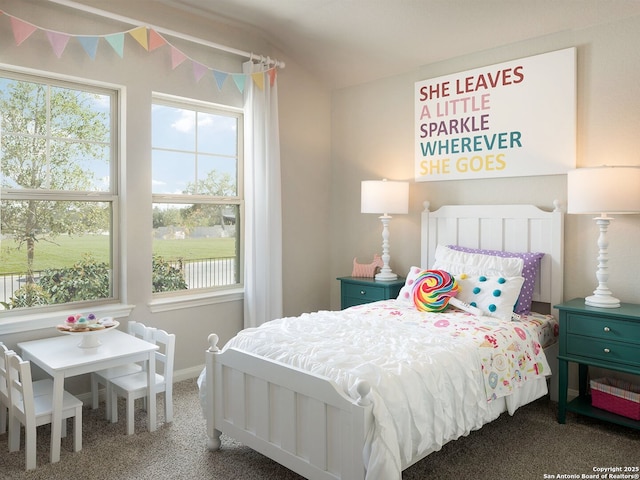 carpeted bedroom featuring lofted ceiling