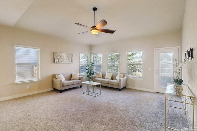 carpeted living room featuring ceiling fan and a healthy amount of sunlight