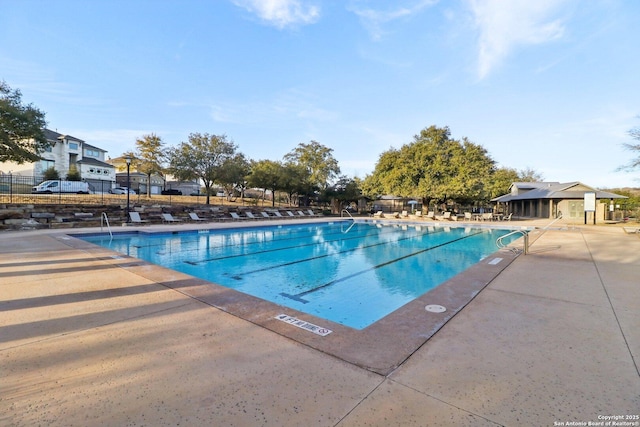 view of swimming pool with a patio