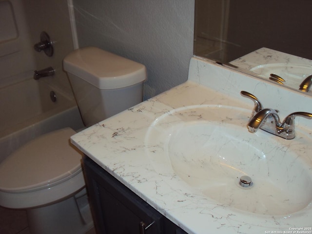 full bathroom with  shower combination, toilet, and vanity