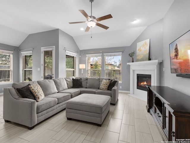 living room featuring plenty of natural light and vaulted ceiling