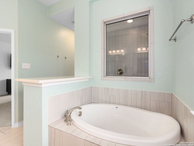 bathroom with tiled bath