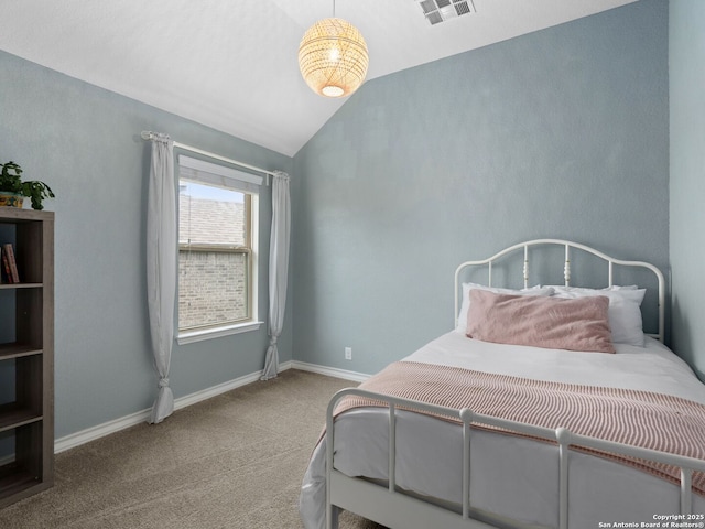 bedroom featuring vaulted ceiling and carpet flooring