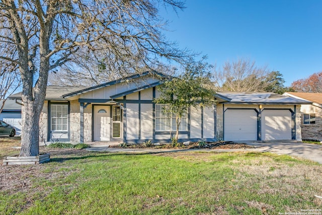 ranch-style home featuring a front yard and a garage