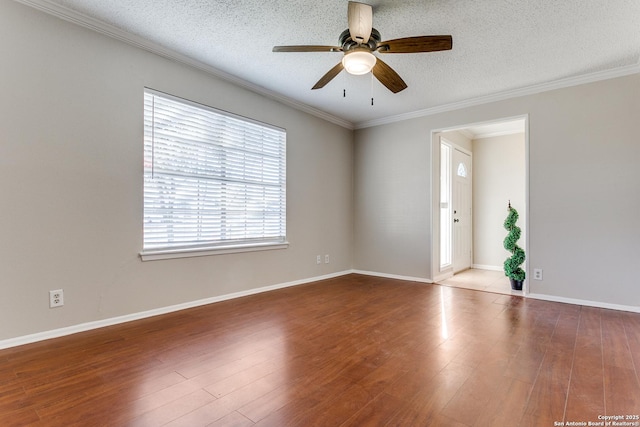 unfurnished room with hardwood / wood-style flooring, ornamental molding, and a textured ceiling