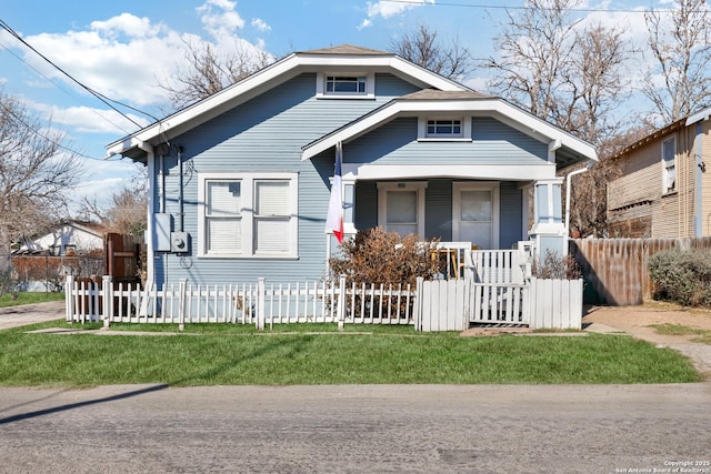 bungalow featuring a front yard and a porch