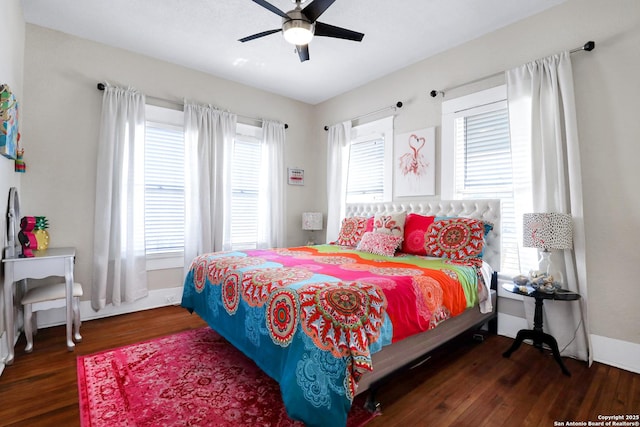 bedroom with ceiling fan and dark wood-type flooring