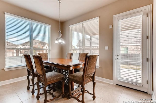 dining space featuring light tile patterned flooring