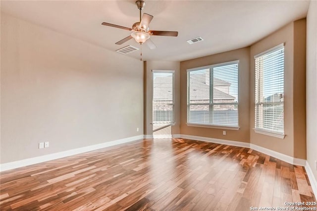 spare room featuring ceiling fan and wood-type flooring